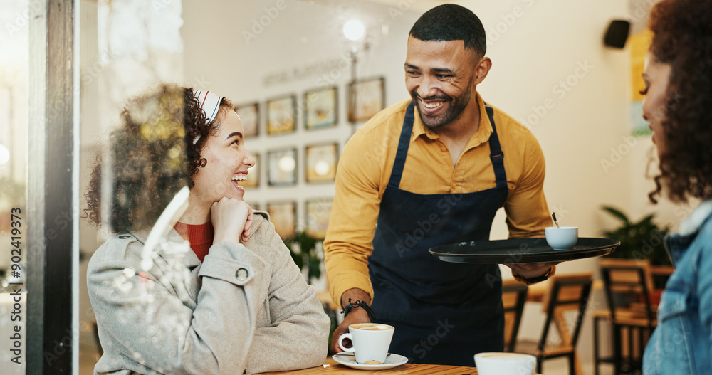 Wall mural Cafe, women and waiter with coffee order, conversation and customer service at restaurant. Barista, staff and happy girl friends with smile and chat at diner with employee helping with hot drink