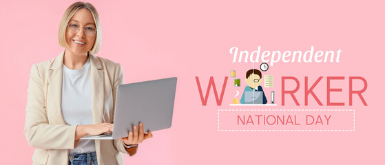 Mature businesswoman working with laptop on pink background