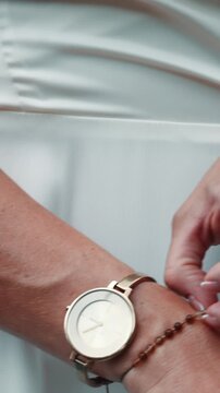 women fixing detail watch 