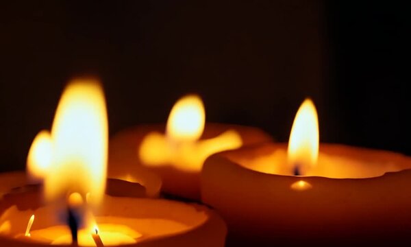 Flickering Hope:  Three candles illuminate the darkness, their flames casting a warm glow, symbolizing resilience, faith, and the enduring power of hope.