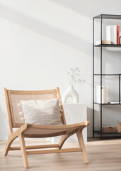 View of modern scandinavian style interior with chair, vase and bookcase, Home staging and minimalism concept