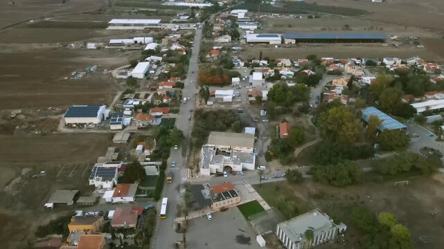 A drone shot at an agricultural settlement in the Negev, southern Israel.
A central road in the middle of the village, behind every house of an agricultural estate