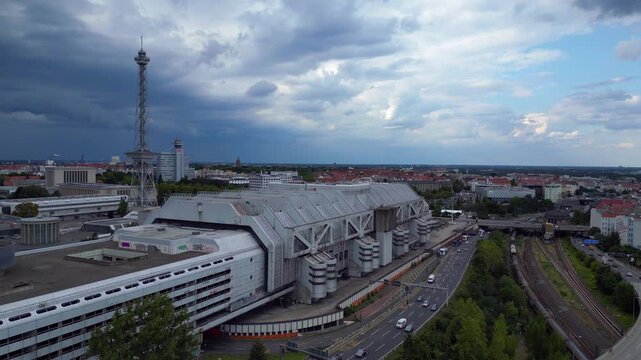 berlin's skyline showcasing the iconic radio tower and exhibition grounds, history and modernity. Spectacular aerial view flight descending drone