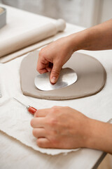 Wedging the clay to eliminate air bubbles. Creating perfect homogenous consistence for ceramics...