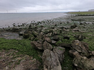 rocks on the beach forming the sea defence