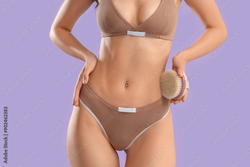 Sticker beautiful young woman with massage brush on purple background, closeup