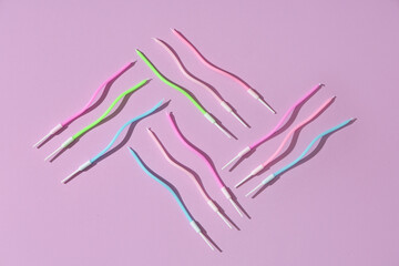 Many colorful Birthday candles on lilac background