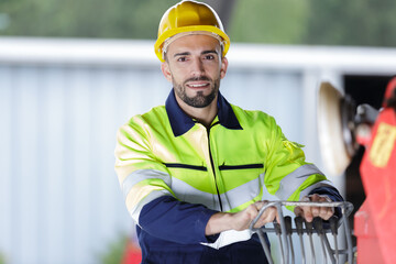 worker wearing hardhat operating levers © auremar