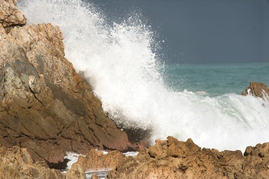 waves crashing on rocks