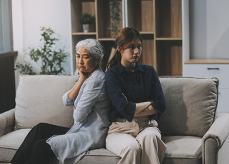 Sad teen granddaughter hugging depressed mature grandmother, giving support, help, comforting, consoling granny. Teenage daughter girl and middle aged mother going through family problems