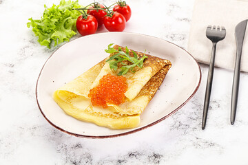Russian pancake with red caviar