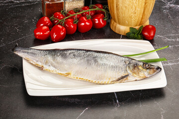 Whole raw salted herring fish