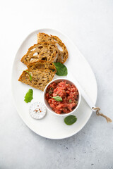 Traditional steak tartare with toast