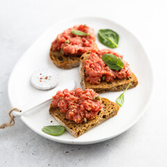 Traditional steak tartare on toast