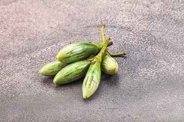 Small organic young green eggplant