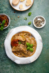 Homemade ravioli with red pesto and nuts