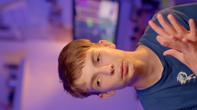 A boy's internal reasoning after games: mental recovery. teenager with brown hair is in a vibrant gaming space filled with modern technology and colorful decor