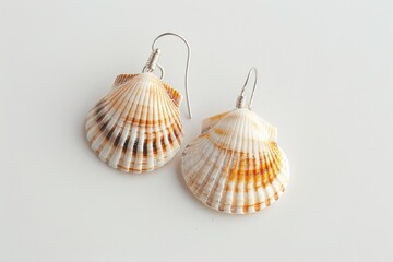 A pair of shell earrings with delicate design, arranged neatly on a white background