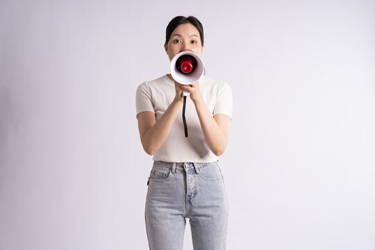 Portrait of beautiful Asian woman posing on white background