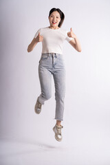 Portrait of beautiful Asian woman posing on white background