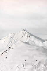Snow-covered mountain peak in a winter landscape