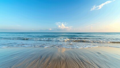 Calm Ocean Waves Breaking on Sandy Beach at Sunset