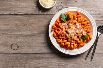 Cavatappi pasta with tomato sauce and grated parmesan cheese