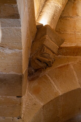 The historic cloister of Monasterio de San Juan de Duero in Soria, Spain, showcasing its iconic arches and ancient stone architecture on a bright sunny day