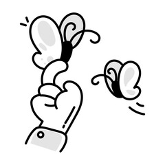 Doodle style icon of butterflies on hand 


