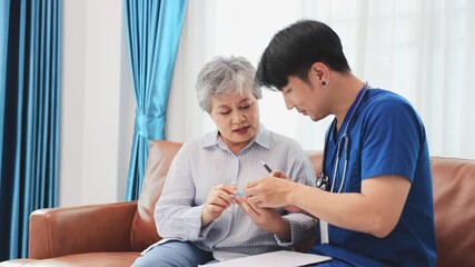 Senior woman get medical service visit from caregiver nurse at home while explaining on doses of vitamin and drug pill for health care and pension welfare insurance concept