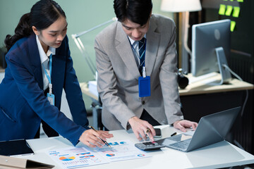 Asian businessman discuss with new startup project Idea presentation, analyze planning and financial statistics and investment market at office.