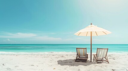 Beach umbrella with two chairs on the sand. summer travel vacation background with copy space
