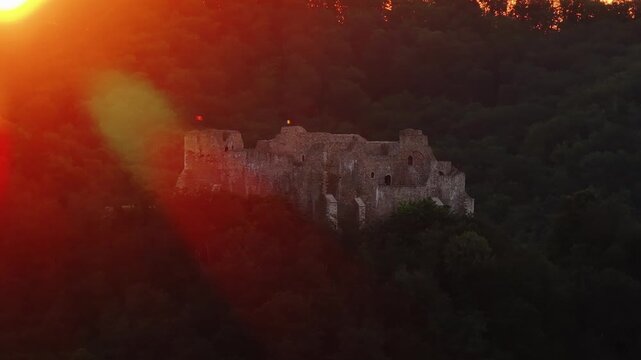 Neamt Fortress (Cetatea Neamtului in Romanian language). 4K aerial close up video with a beautiful sunrise over this iconic fortress from Moldova, Romania. Travel to Romania history landmarks.