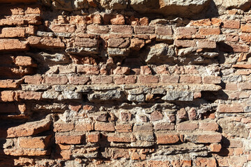 An old brick wall on a city building