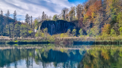 Scenic view of majestic waterfall Veliki Prstavac in magical Plitvice lakes National Park, Karlovac, Croatia, Europe. Powerful cascades in serene autumn landscape. Wanderlust in green natural paradise © Chris