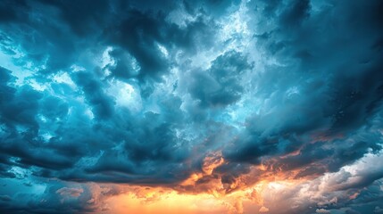 Fototapeta premium Expansive stormy sky blending blue and orange hues.