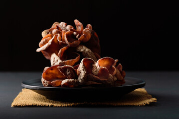 Fresh black jelly mushroom on black background, Local ingredients for vegetarian cooking