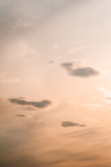 orange sky with small clouds during sunset