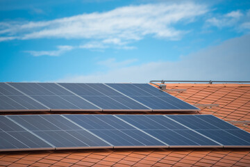 Solar panels on the roof of  house with natural sunlight. Environment and technology concepts.