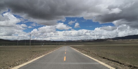 road in the mountains with sky in Tibet