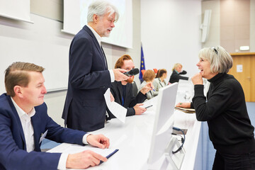 Orator discussing with audience at stage in conference