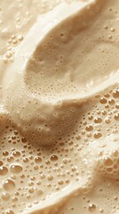 Bubbles in a creamy beige liquid. Make the bubbles various sizes and the liquid thick and viscous.