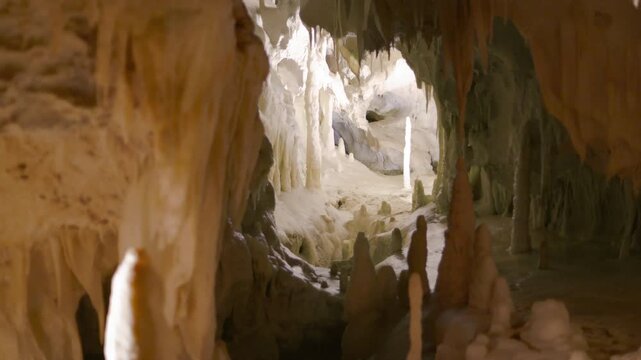 Frasassi Caves, fascinating view of the depths of the caves covered in very white calcite and full of stalactites and stalagmites. Geological wonders of the Marche, Italy.