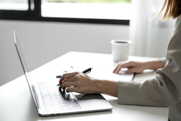Fototapeta premium Business woman employer holding resume hiring recruit looking cv resume to hire candidates, analyzing information before job interview. Recruitment concepts