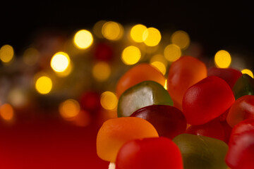 Christmas Gummy Colorful Candy on Garland Background.