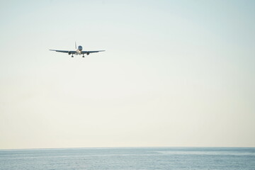 Naklejka premium The plane is flying over the Black Sea. Landing approach.