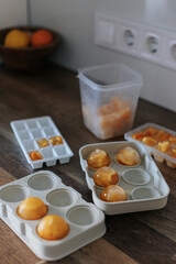 making orange ice in a bright kitchen