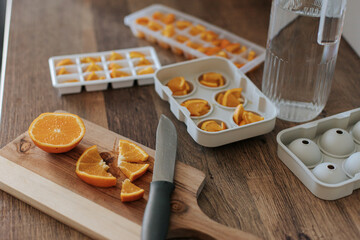 making orange ice in a bright kitchen