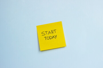 A post-it note that says 'start today' 