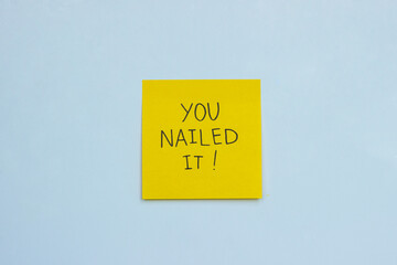 A yellow sticky note that says 'you nailed it!' on light-blue background
